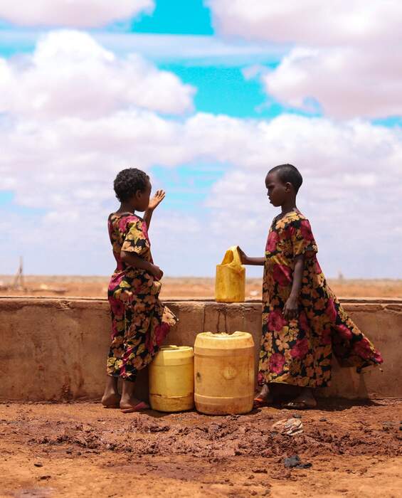 Drinking water for two children in Kenya Two children at a water point in Kenya - drinking water thanks to development aid.