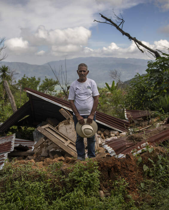 Help with reconstruction in Honduras A man stands in front of the ruins of his home in La Reina, Honduras - donations help rebuild after the hurricanes Eta and Iota.